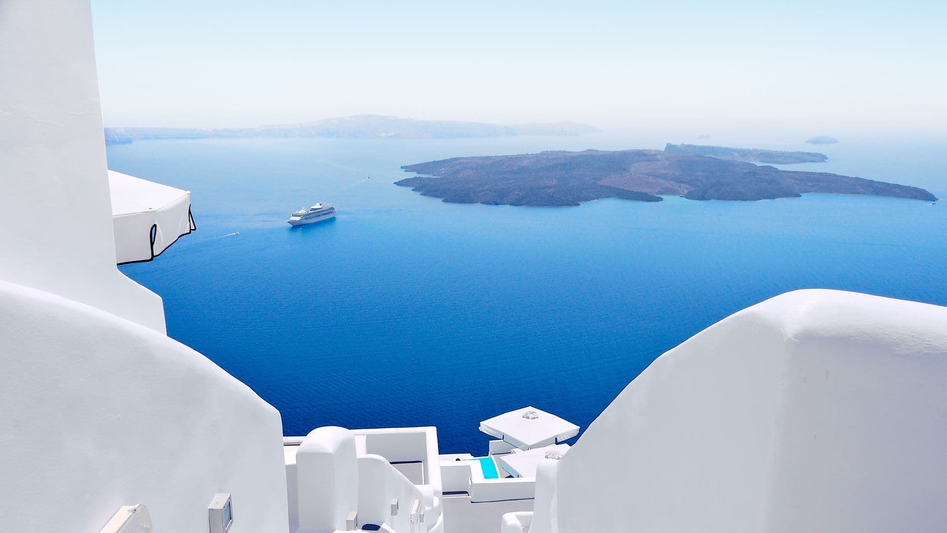 Caldera and Aegean Sea viewed from Santorini's whitewashed cliffs